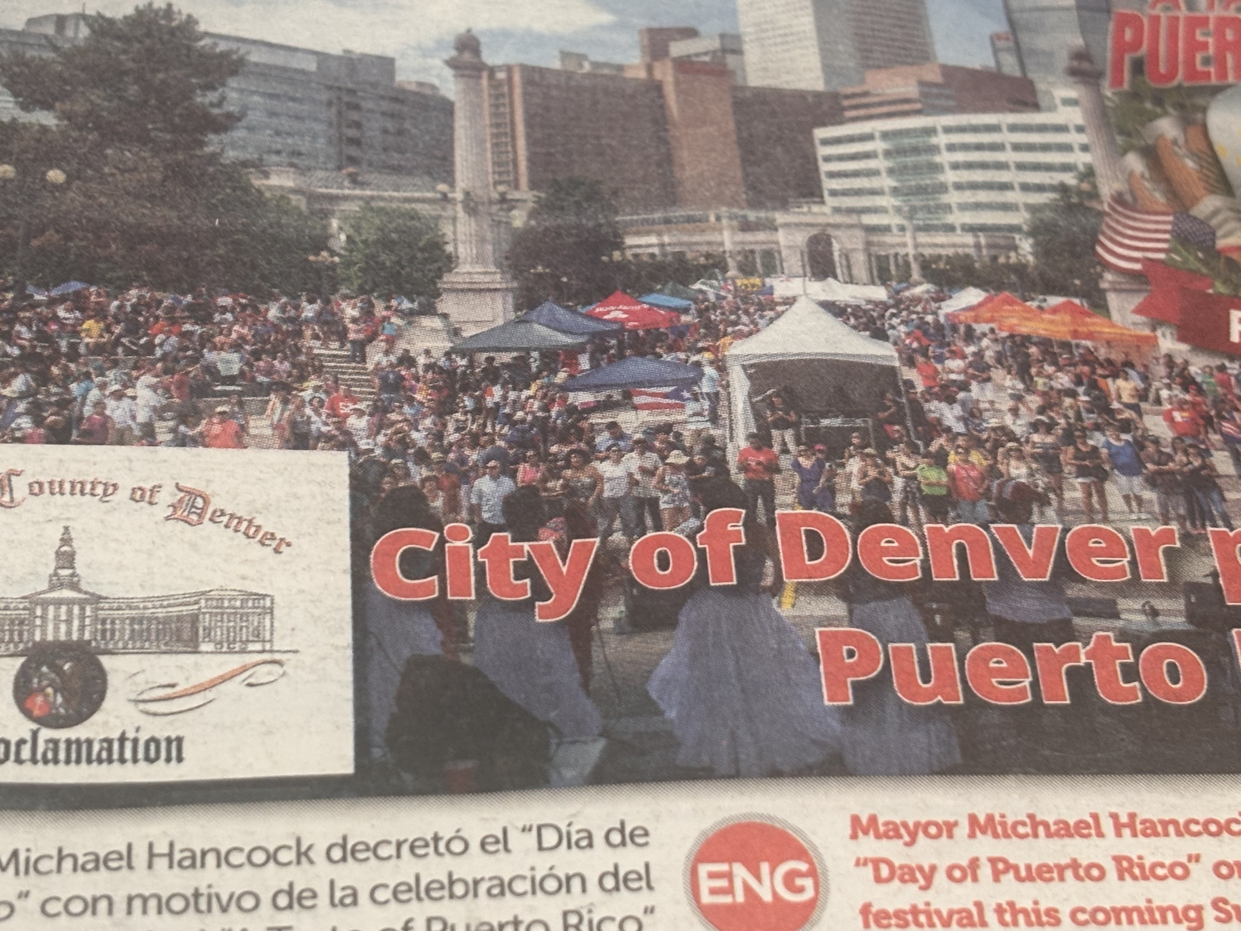 Newspaper clipping: Mayor Michael Hancock proclaimed a Day of Puerto Rico for Alvin's Denver festival